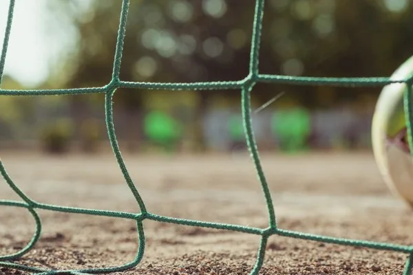 soccer ball in goal net